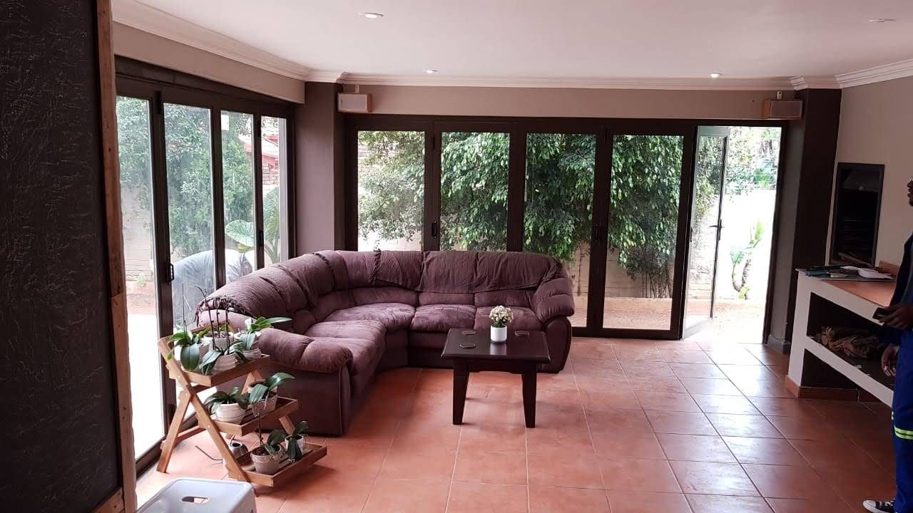 Aluminium doors fitted around an enclosed patio room